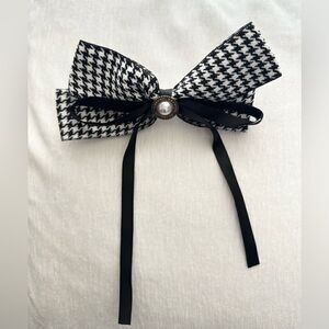 Black and white houndstooth bow with pearl and rhinestone accents
